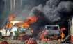 Smoke billows out of burning cars during 'Bharat Bandh'