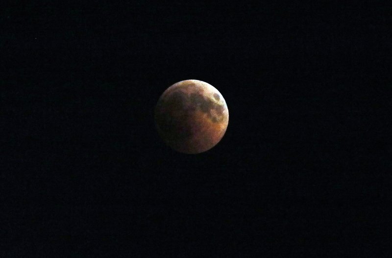 The reason this lunar eclipse is the longest of the 21st century is because it passes through the center of Earth's shadow, increasing the time in which the moon is blocked from the sun (Picture from Ankara, Turkey)