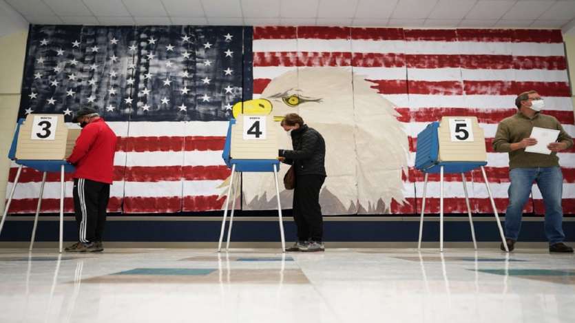 Voters cast their ballots under a giant mural at Robious Elementary school in Midlothian.