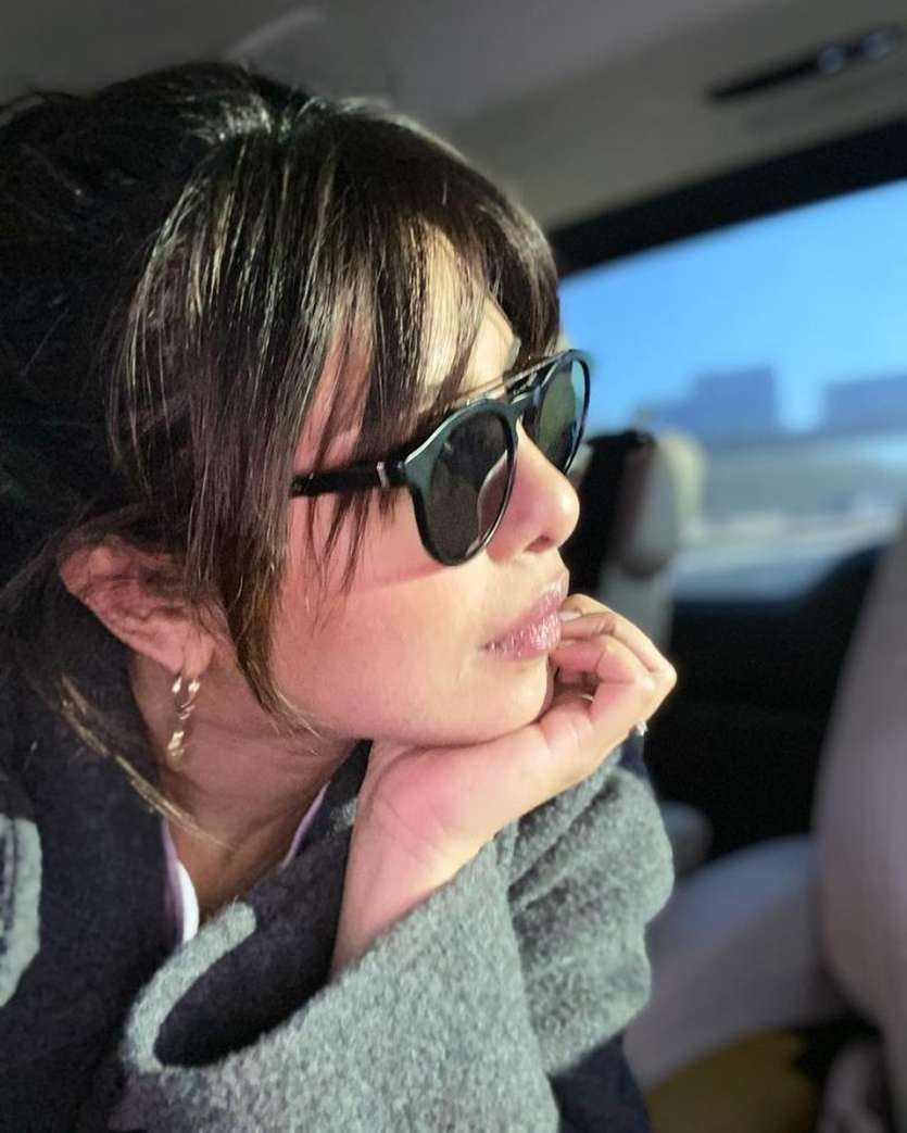 A casual picture of Priyanka Chopra Jonas wearing big black shades.