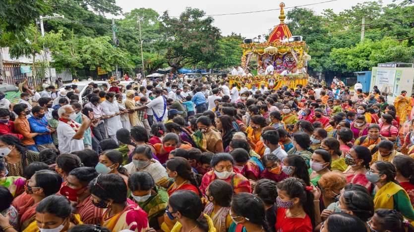Devotees pull a chariot carrying the idol of Lord Jagannath during the Rath Yatra festival in Hyderabad.