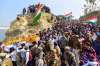 People attend the funeral procession of CRPF jawan Mahesh