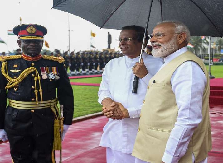 Prime Minister Narendra Modi shakes hands with Sri Lankan